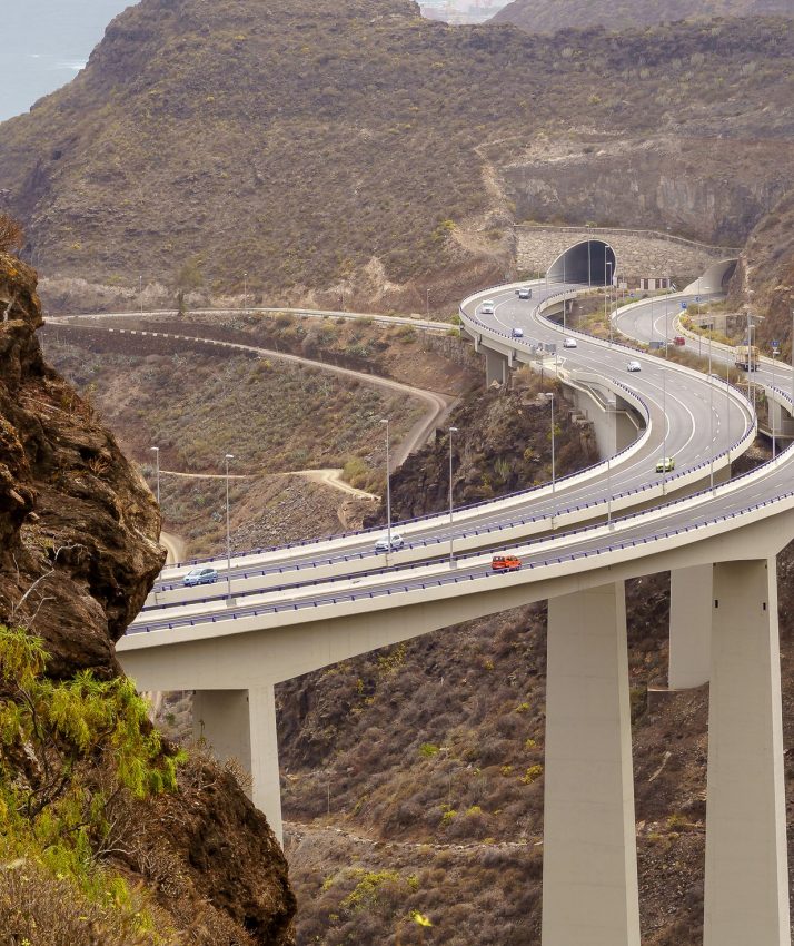 road over huge bridge bordering the mountains by the sea on the island of Gran Canaria. Spain
